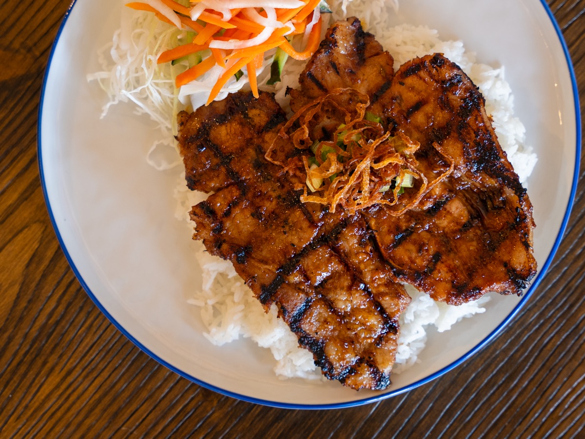 Grilled pork chops on rice with pickled vegetables